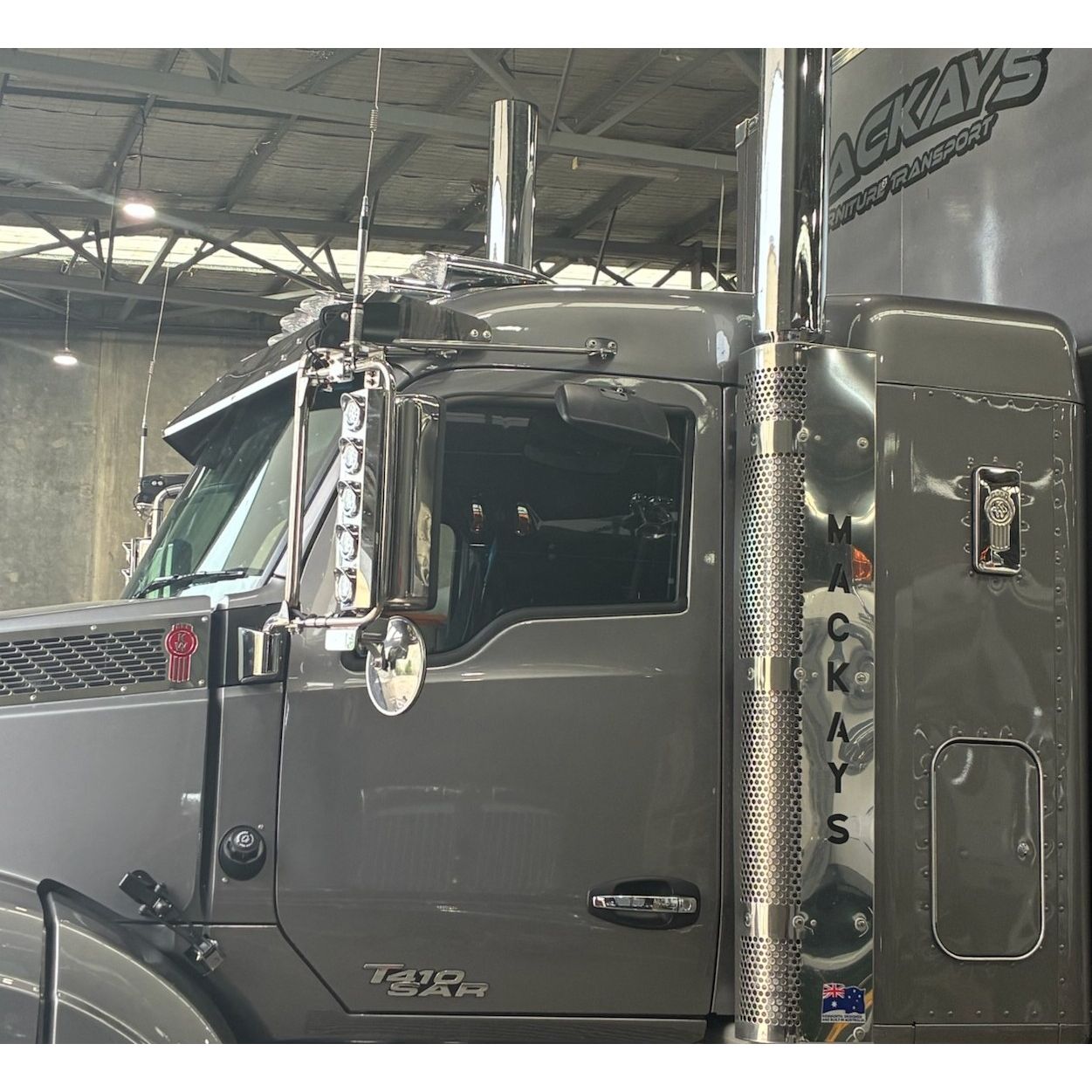 RTE Custom Trucks 12" mid roof cab visor for Kenworth T610/T410, showcasing side view and sleek design.