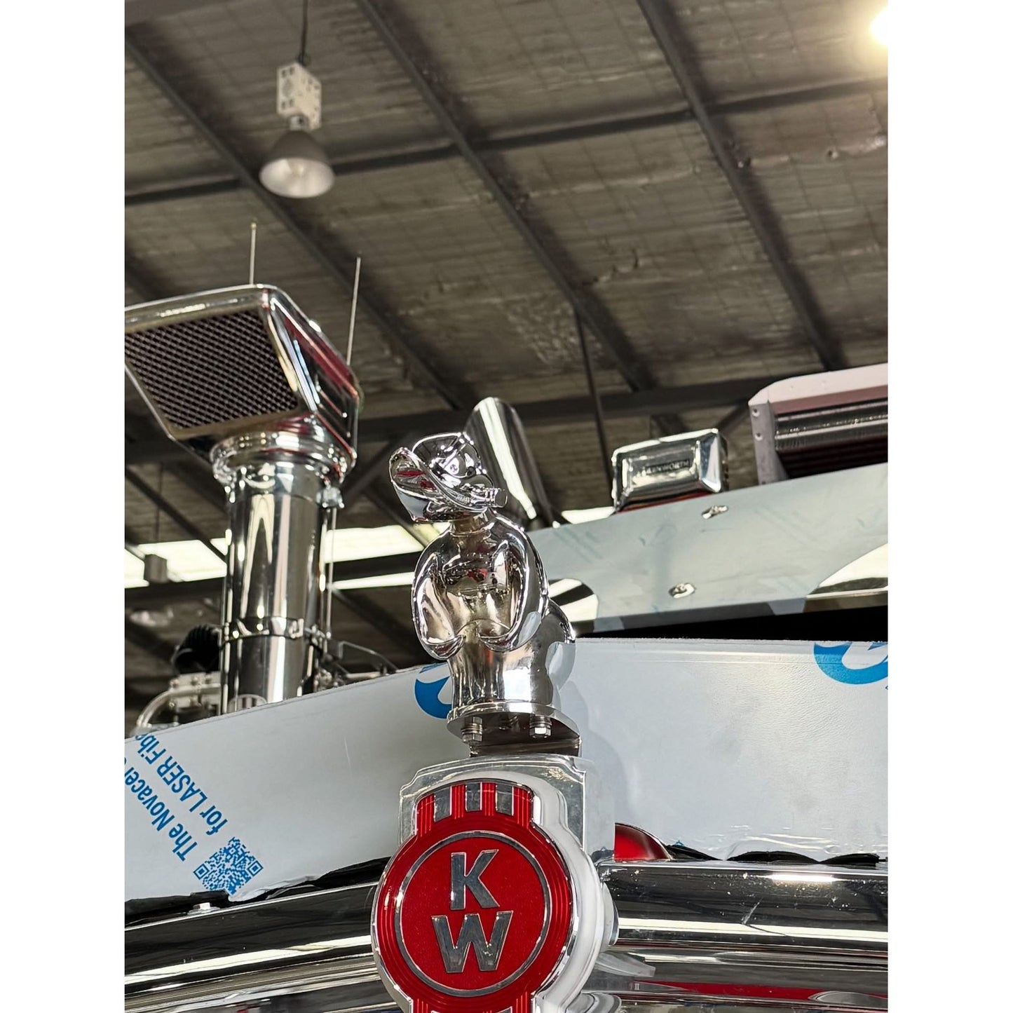 Chrome duck hood ornament by RTE Custom Trucks, showcasing a polished finish and detailed design for vehicle customization.
