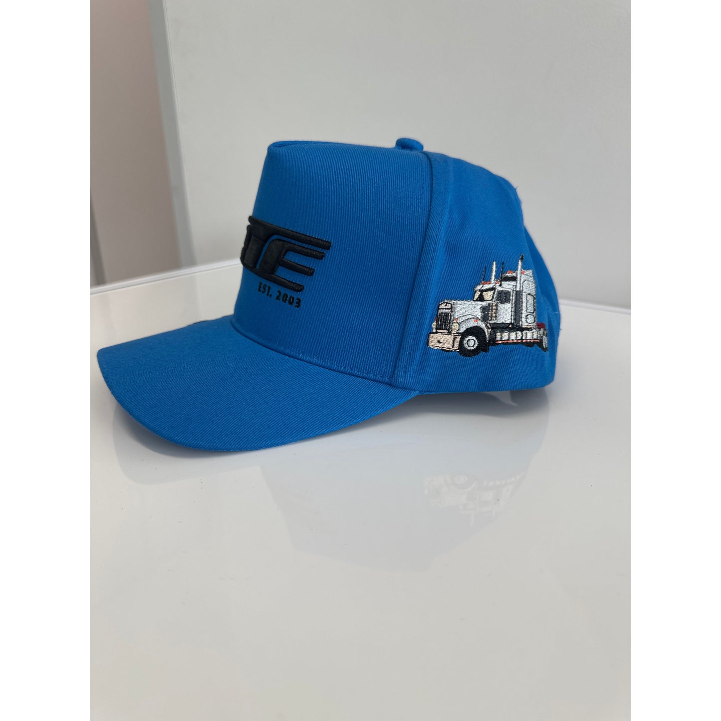 CTC Blue RTE Hat by RTE Custom Trucks, featuring a blue fabric and adjustable strap, displayed on a neutral background.