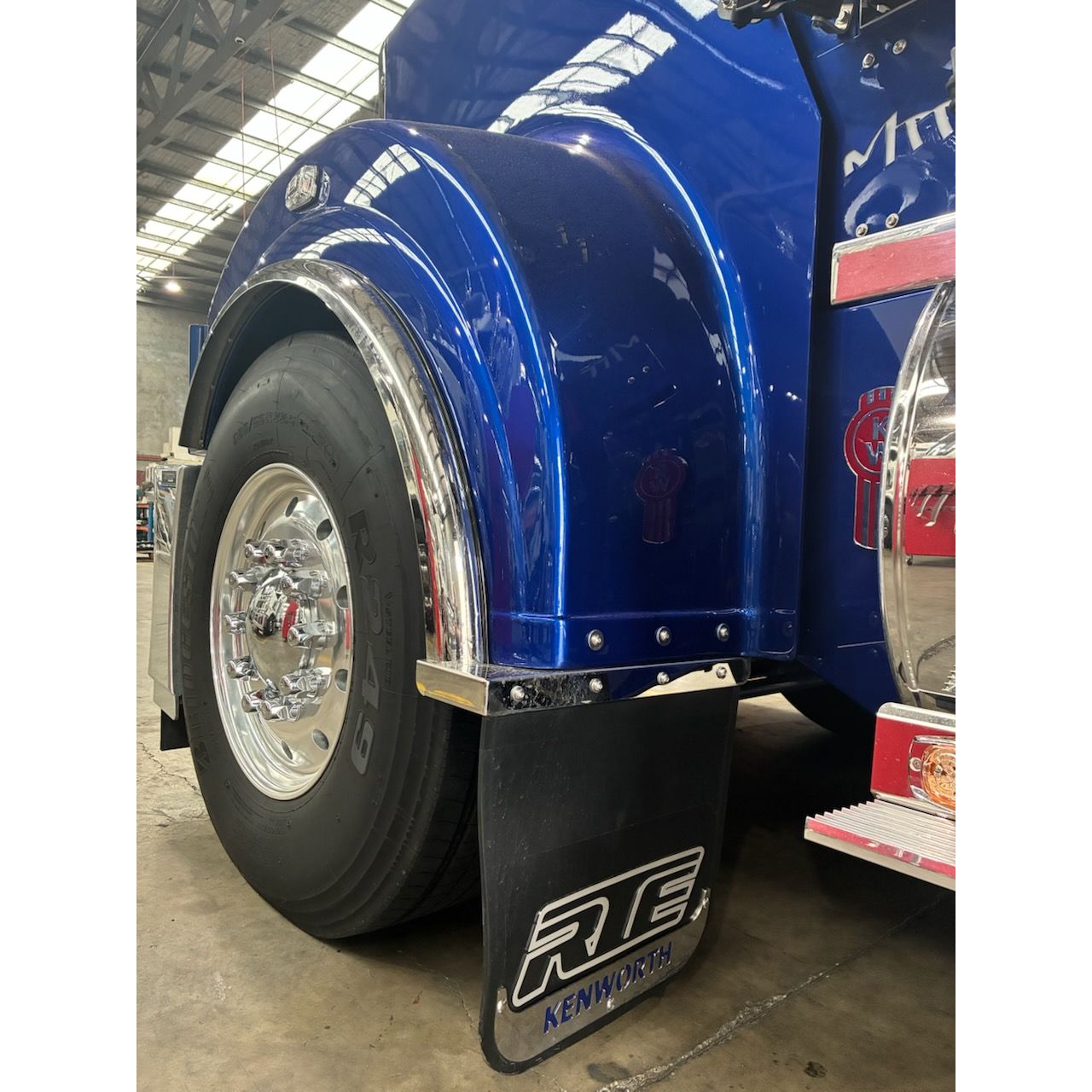 RTE Custom Trucks T909 Mudflap Extension displayed on a truck, showcasing its durable design and fit for heavy-duty use.