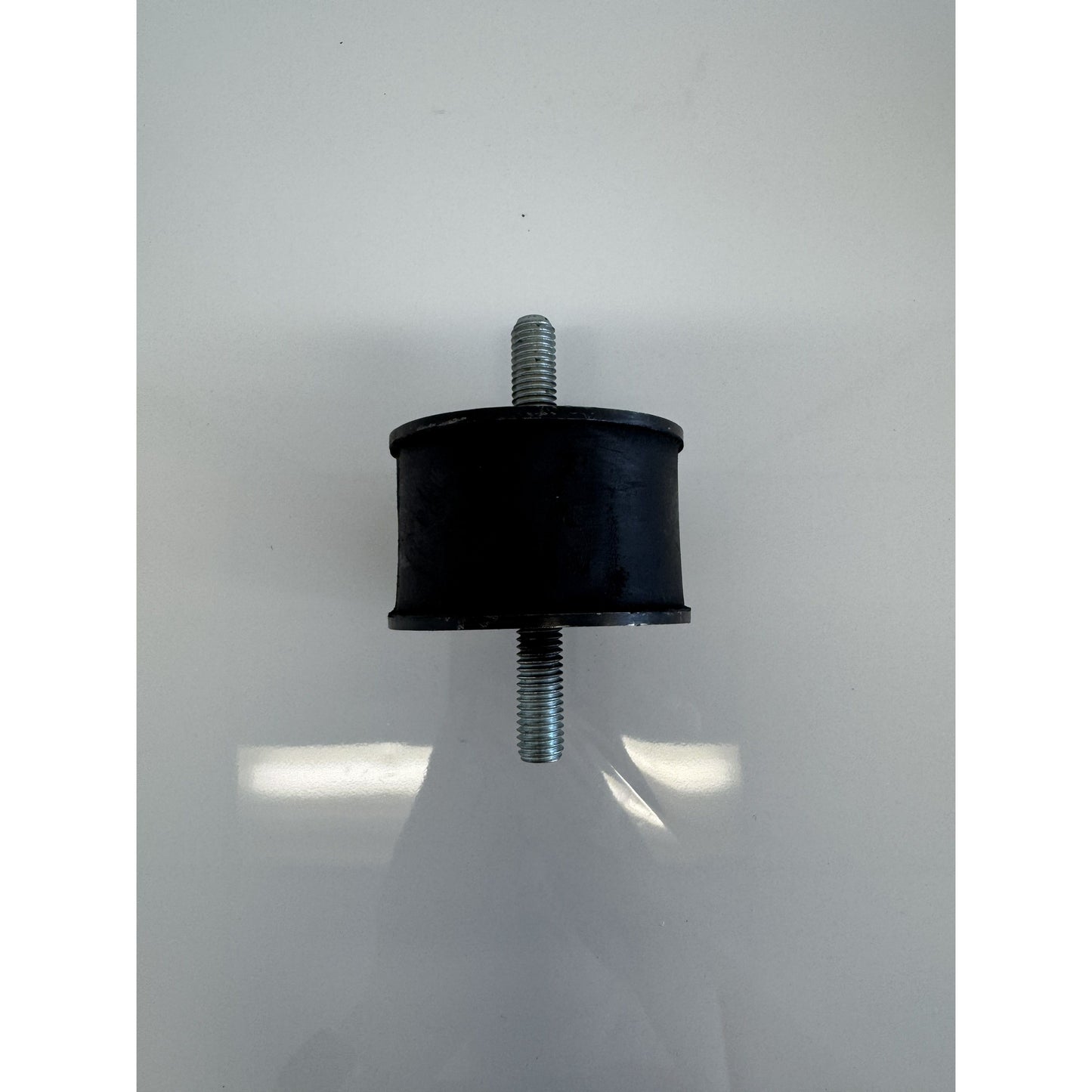 Large rear mount rubber mount by RTE Custom Trucks, showcasing its sturdy design and durable material for vehicle support.