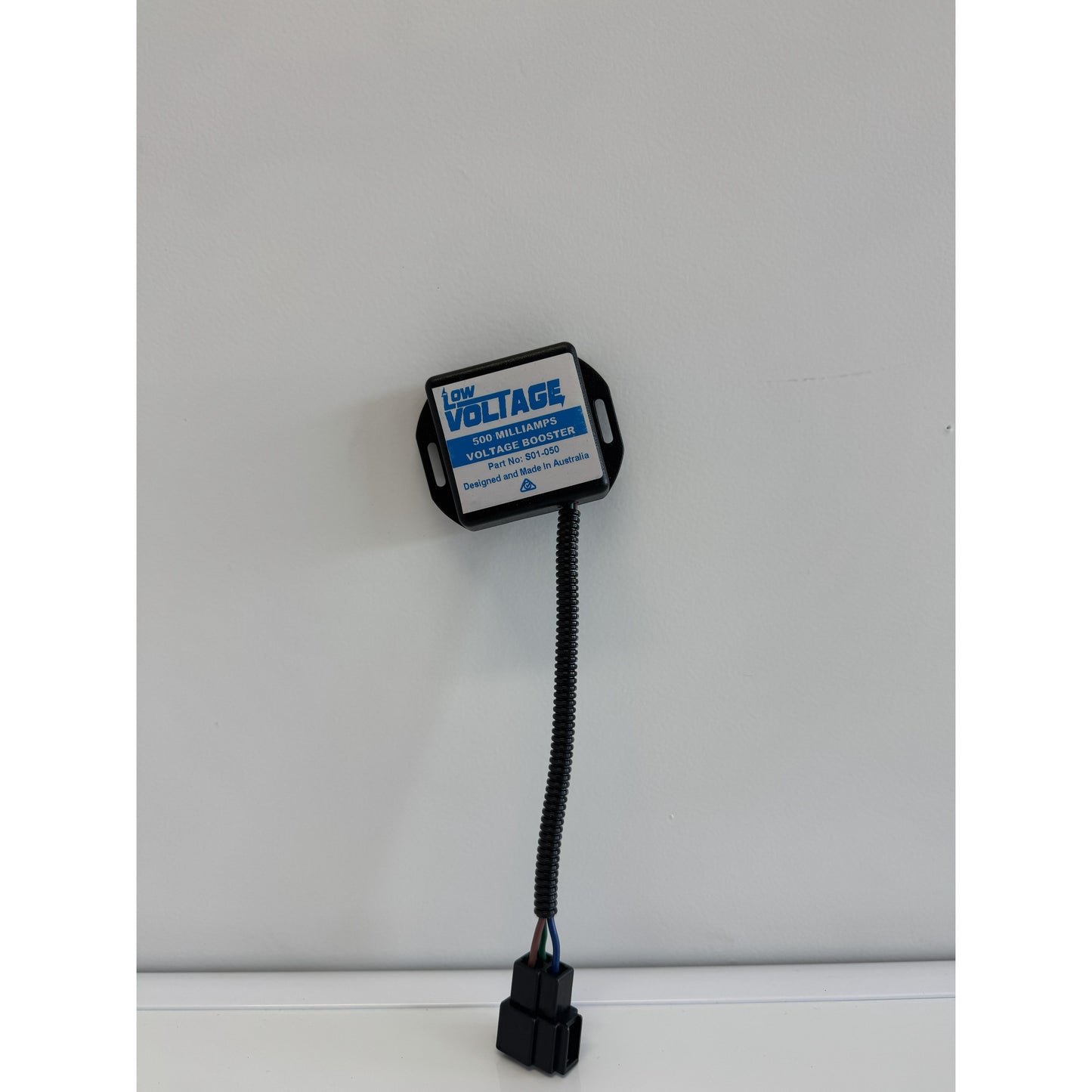 RTE Custom Trucks voltage booster with sleek design and compact size, showcasing connections and mounting features.