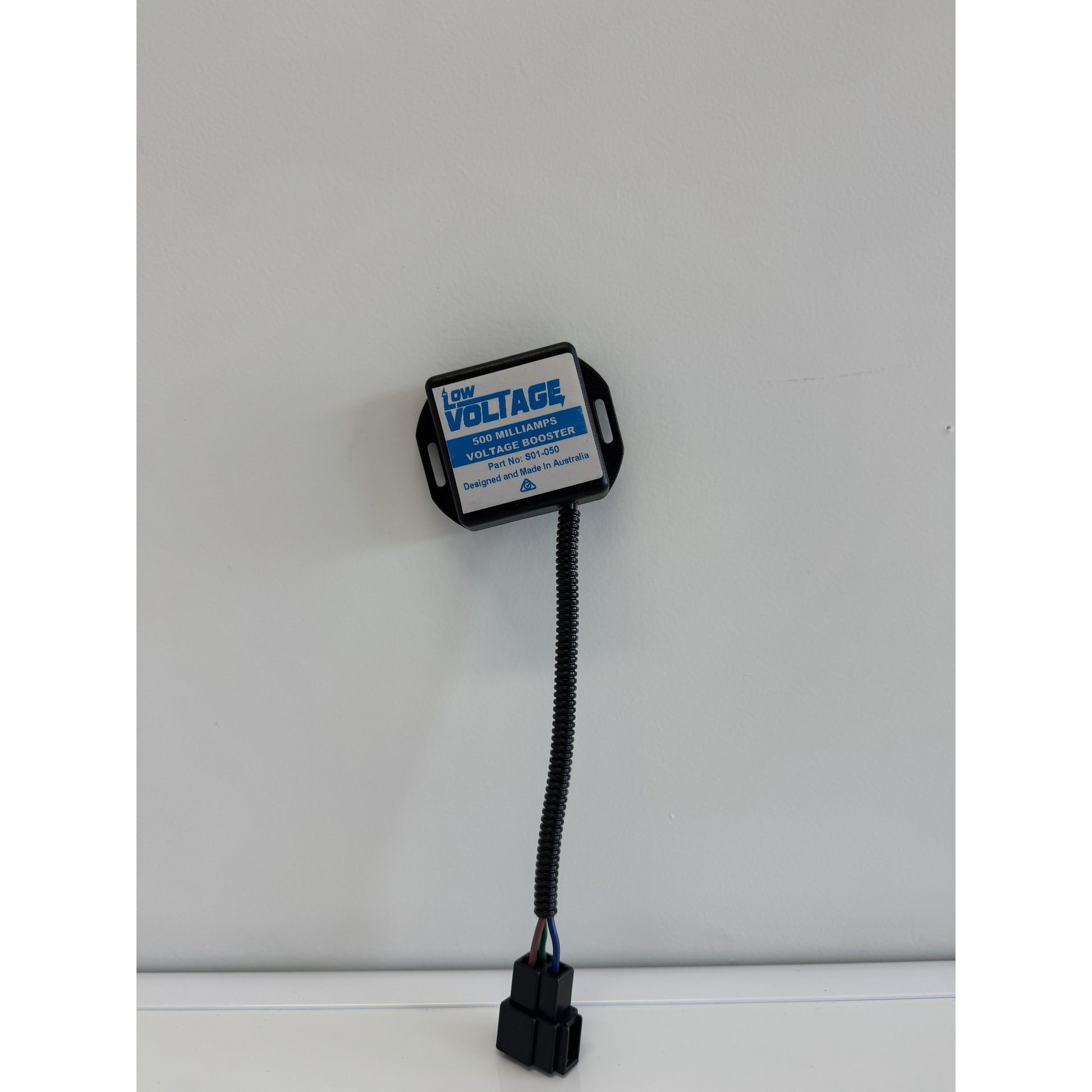 RTE Custom Trucks voltage booster with sleek design and compact size, showcasing connections and mounting features.