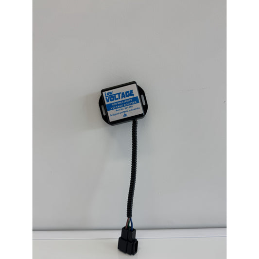 RTE Custom Trucks voltage booster with sleek design and compact size, showcasing connections and mounting features.