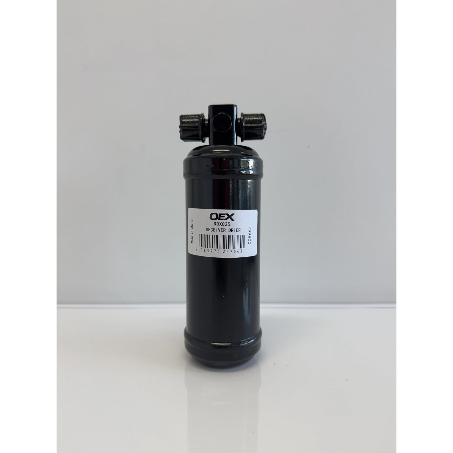 RTE Custom Trucks receiver drier with a cylindrical design, showcasing metal construction and connection ports.